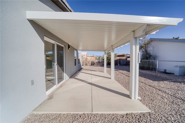 view of patio featuring fence