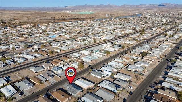 birds eye view of property with a residential view and a mountain view