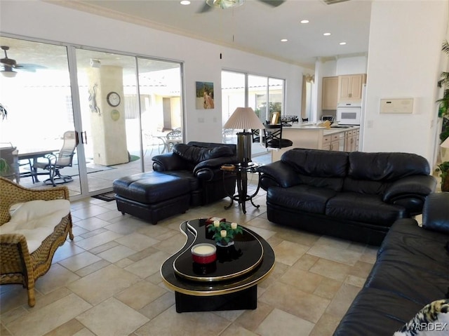 living area featuring visible vents, ornamental molding, a ceiling fan, and recessed lighting