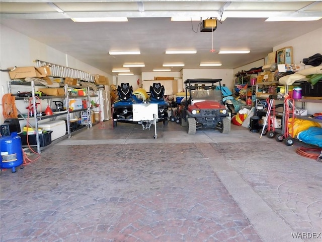 garage featuring a garage door opener