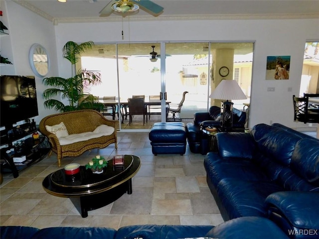 living room featuring a ceiling fan and crown molding