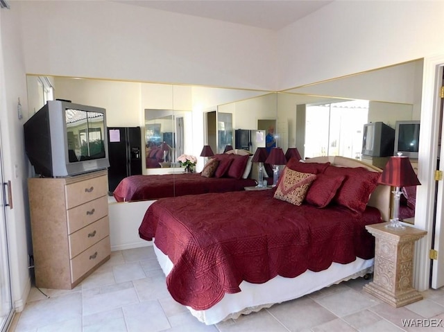 bedroom with light tile patterned floors