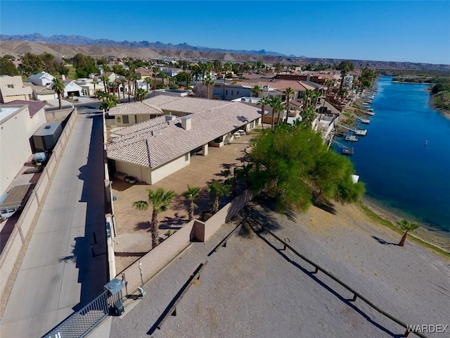 birds eye view of property with a residential view and a water and mountain view