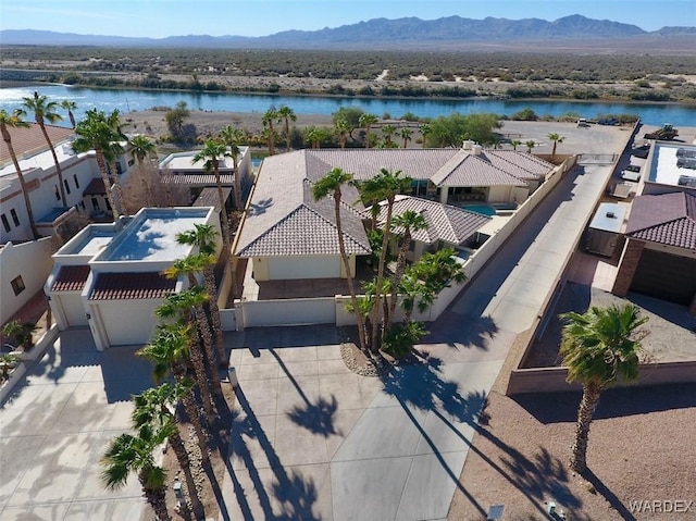 aerial view featuring a residential view and a water and mountain view