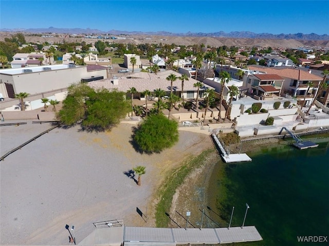 birds eye view of property with a residential view and a water and mountain view