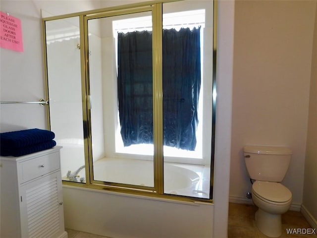 full bath featuring toilet and bath / shower combo with glass door