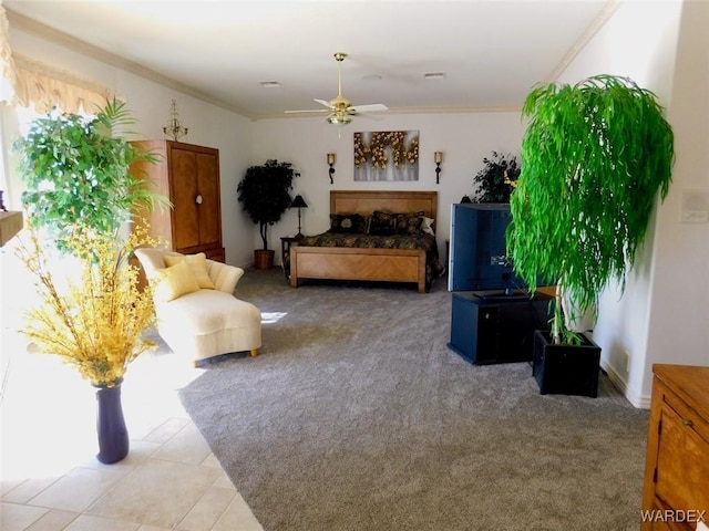 interior space with light carpet, ceiling fan, visible vents, and crown molding