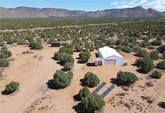 birds eye view of property featuring a mountain view