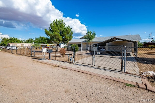 view of front of property featuring a gate and fence