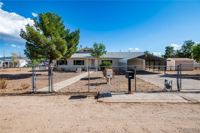 view of front of property with driveway, a gate, and fence