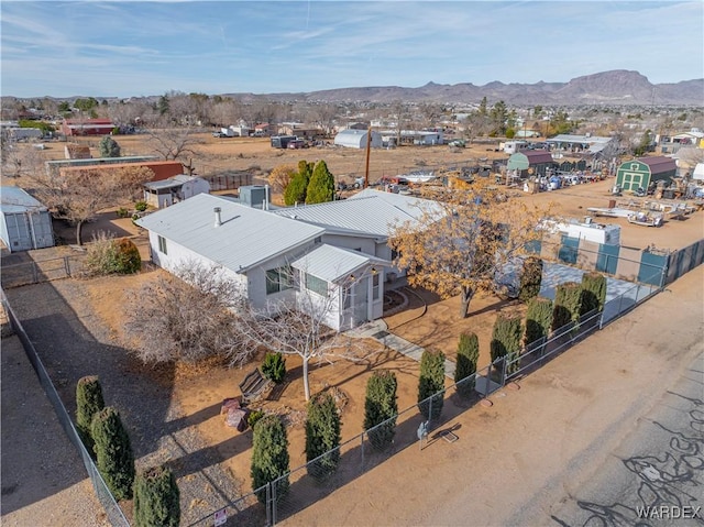 birds eye view of property featuring a mountain view