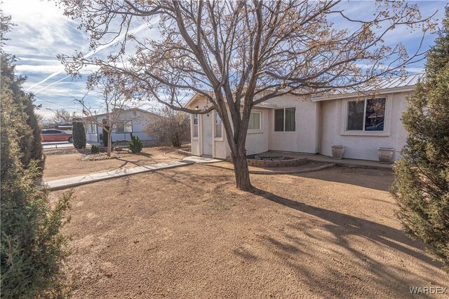 view of front of property featuring stucco siding