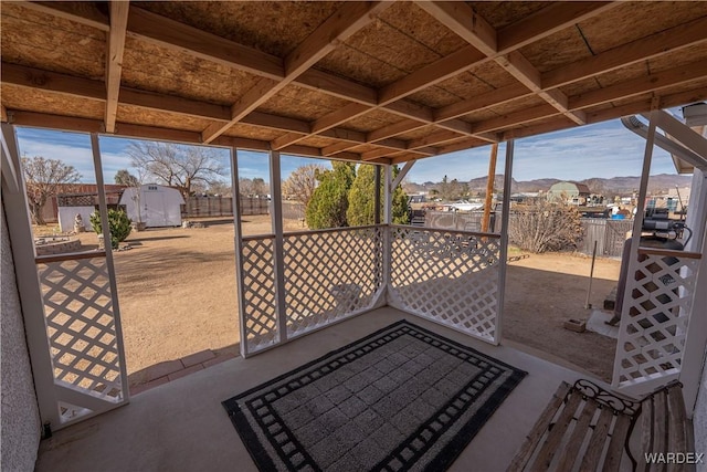 exterior space featuring a residential view and fence