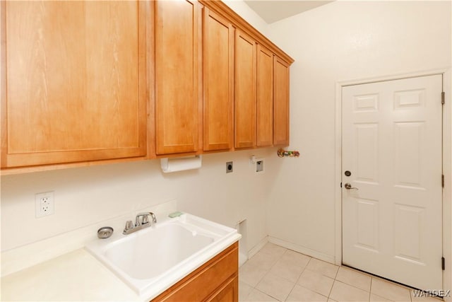 laundry room with light tile patterned floors, washer hookup, baseboards, cabinet space, and electric dryer hookup