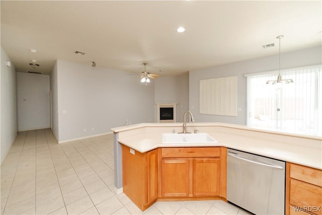 kitchen featuring visible vents, open floor plan, light countertops, stainless steel dishwasher, and a sink