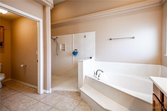 full bath with toilet, tile patterned floors, walk in shower, vanity, and a bath