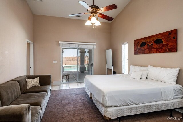 tiled bedroom with access to exterior, visible vents, high vaulted ceiling, and carpet