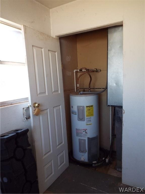 utility room with electric water heater