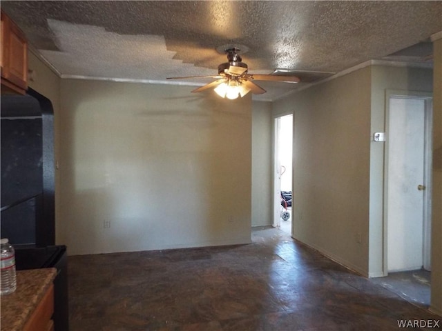 empty room featuring crown molding, ceiling fan, and a textured ceiling
