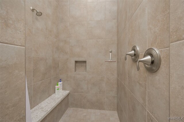 bathroom with tiled shower