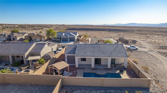 drone / aerial view with a mountain view and a residential view