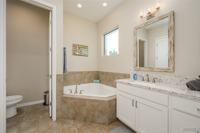 full bathroom with a bath, vanity, toilet, and tile patterned floors