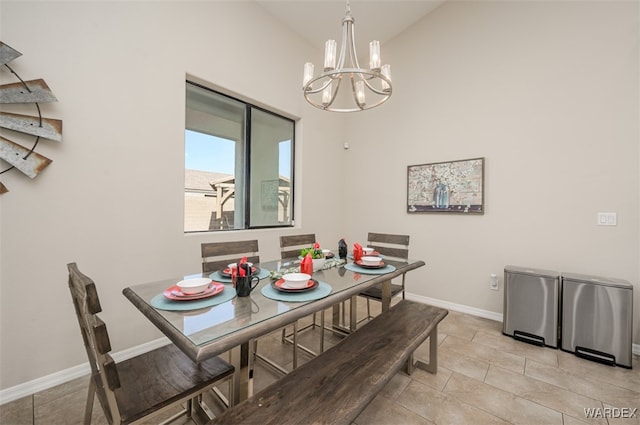 dining room featuring an inviting chandelier, baseboards, and light tile patterned flooring