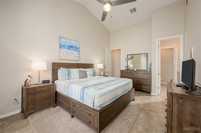 bedroom featuring high vaulted ceiling, visible vents, baseboards, and light tile patterned floors