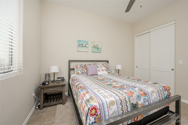 bedroom featuring a closet, a ceiling fan, and baseboards