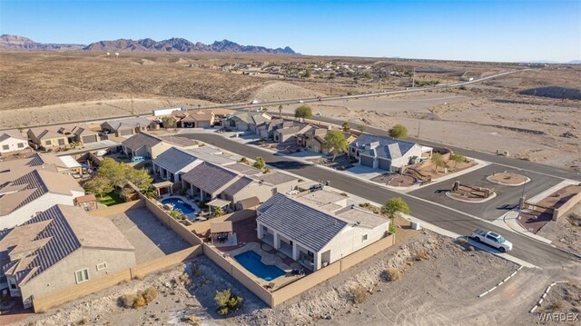 birds eye view of property with a mountain view and a residential view