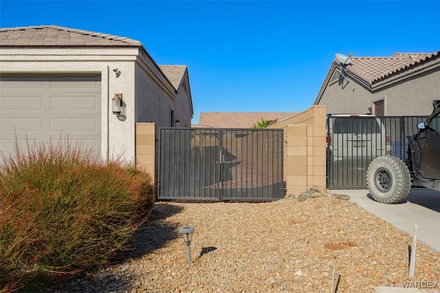 view of gate featuring fence