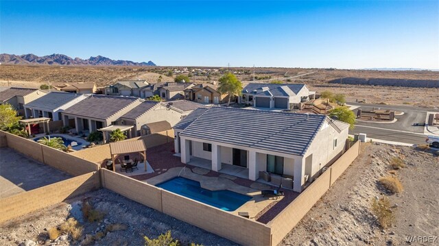 birds eye view of property with a mountain view and a residential view