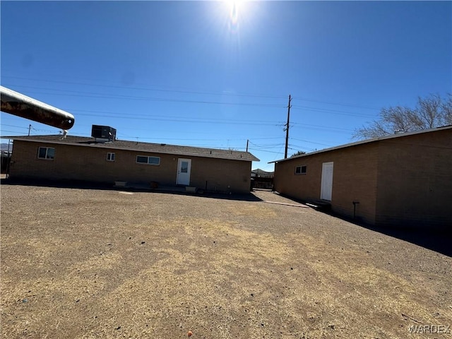 back of property with central AC unit