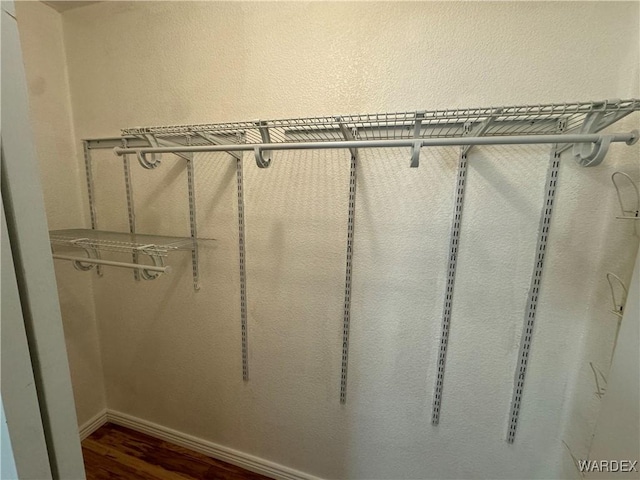 spacious closet with wood finished floors