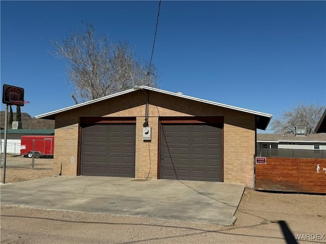 garage with fence