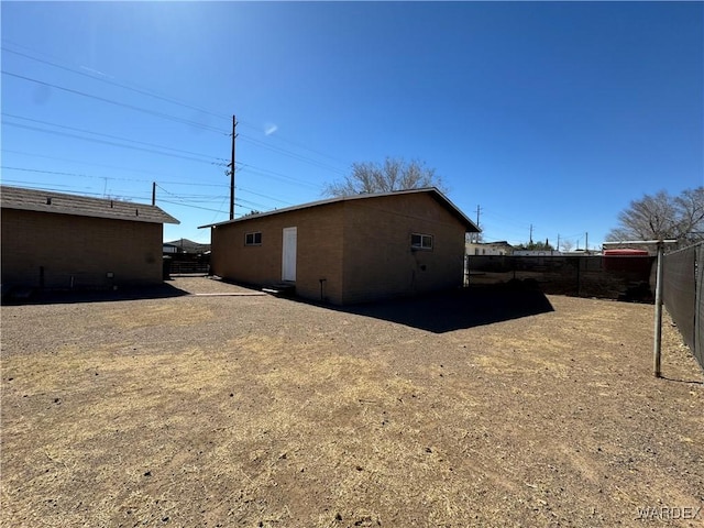 view of home's exterior with fence