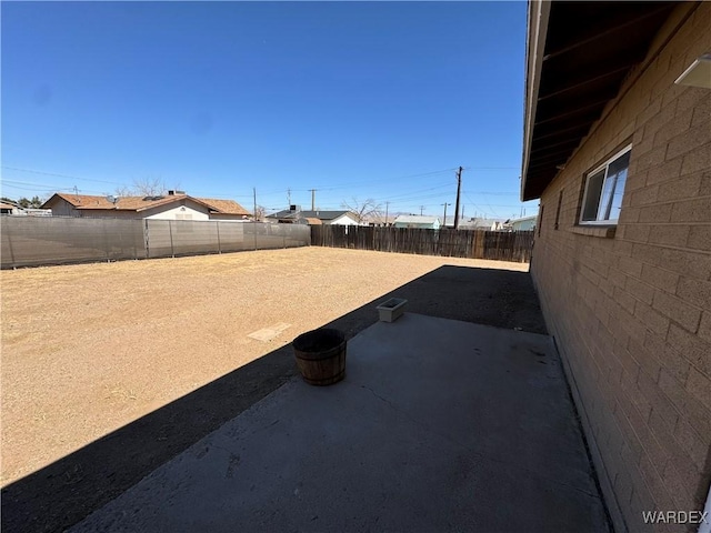 view of yard featuring a fenced backyard and a patio