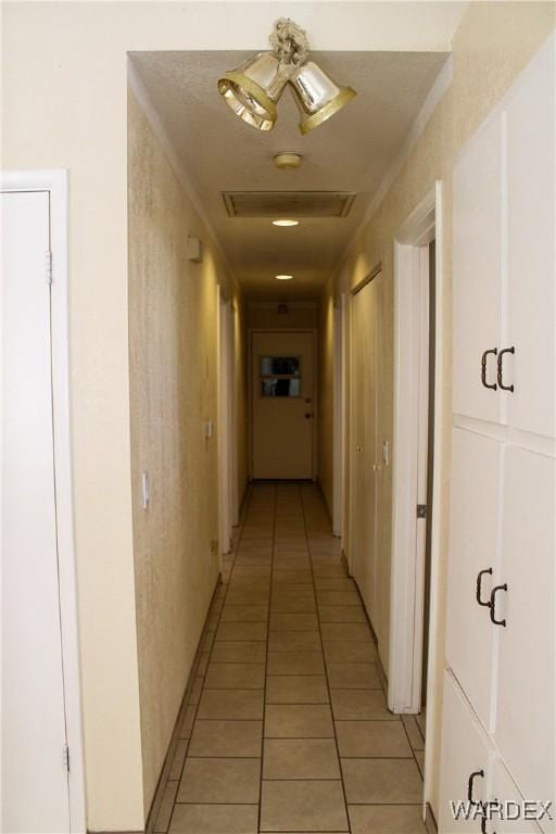 hall with light tile patterned flooring