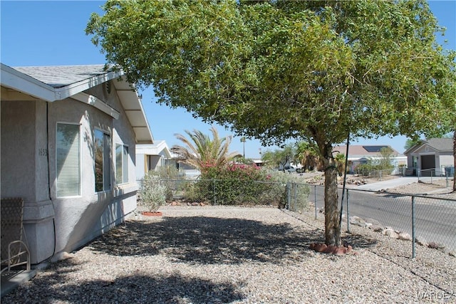 view of yard featuring a residential view and a fenced backyard