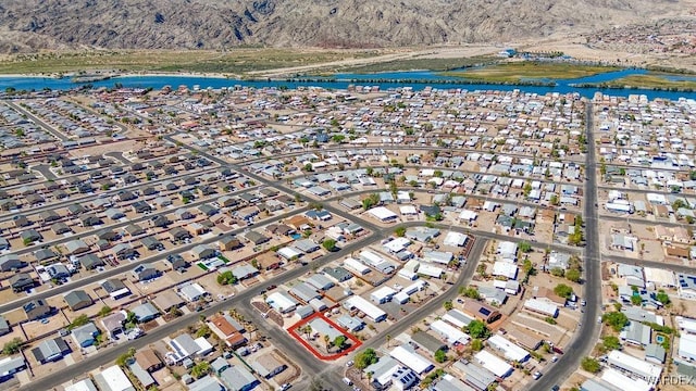 drone / aerial view with a water view and a residential view