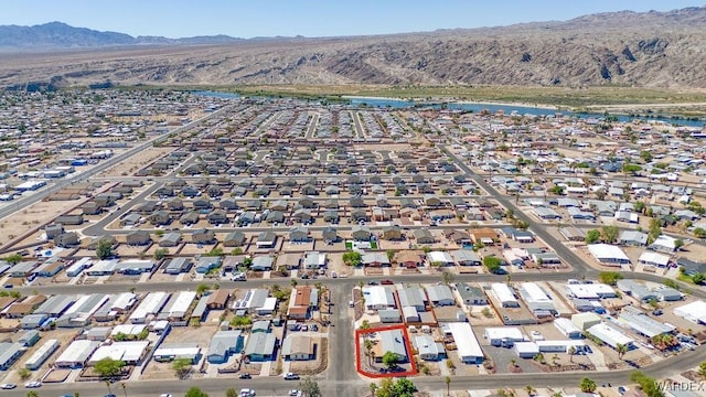 drone / aerial view with a residential view and a water and mountain view