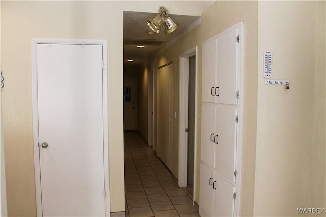 hallway with light tile patterned floors