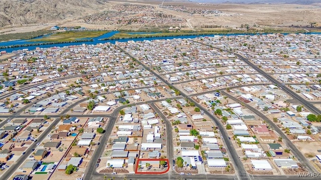 bird's eye view featuring a water view and a residential view