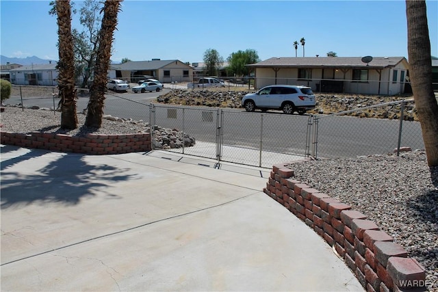 exterior space featuring a gate and fence