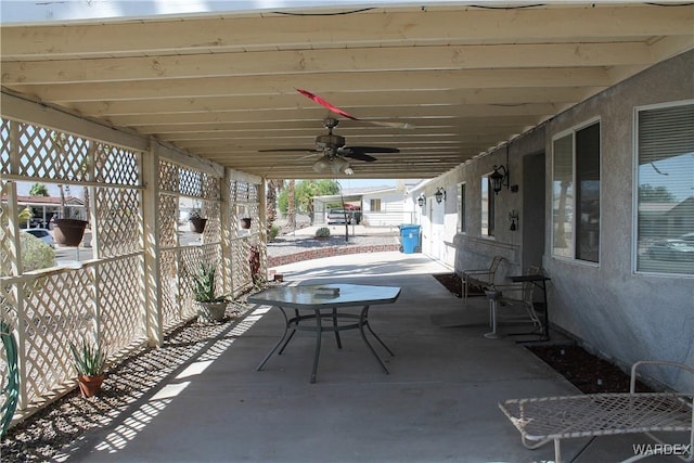 view of patio / terrace featuring fence and a ceiling fan