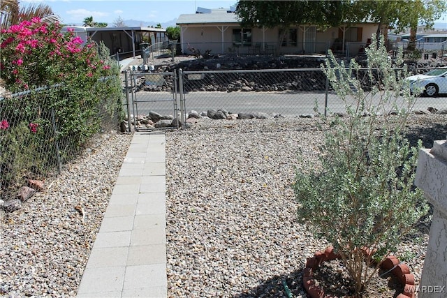 exterior space featuring a gate and fence