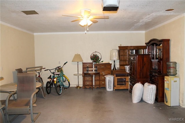 garage featuring a ceiling fan and a garage door opener