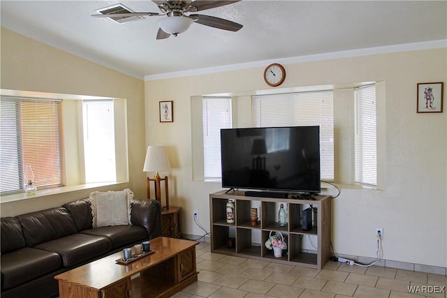 living room featuring lofted ceiling, ceiling fan, baseboards, and light tile patterned floors