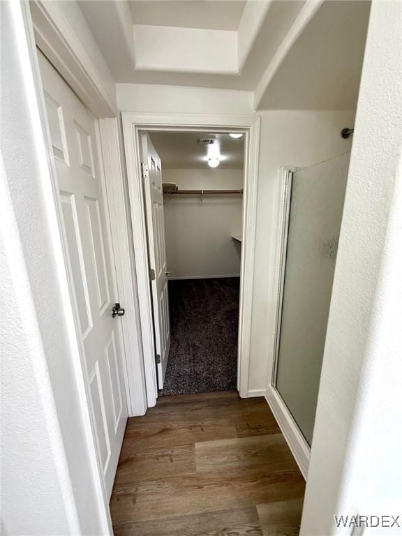 corridor featuring wood finished floors