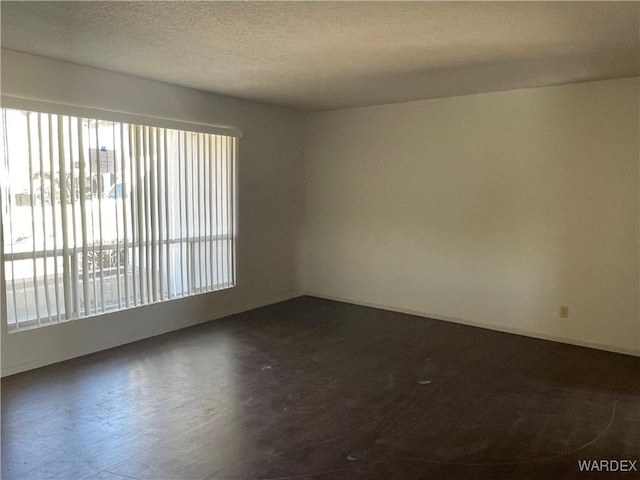 empty room with a textured ceiling